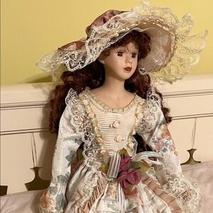 Elegant Porcelain Doll with Floral Dress and Hat